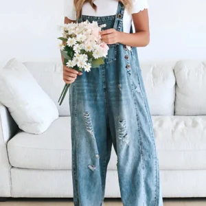 Vid denimjumpsuit med slitt finish
