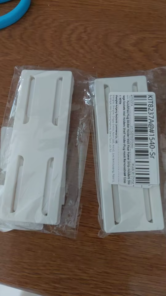 Hållare för väggkontakt photo review